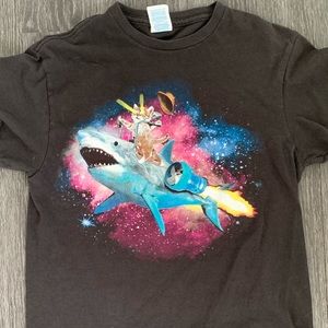Graphic T-shirt with a kitten riding a shark